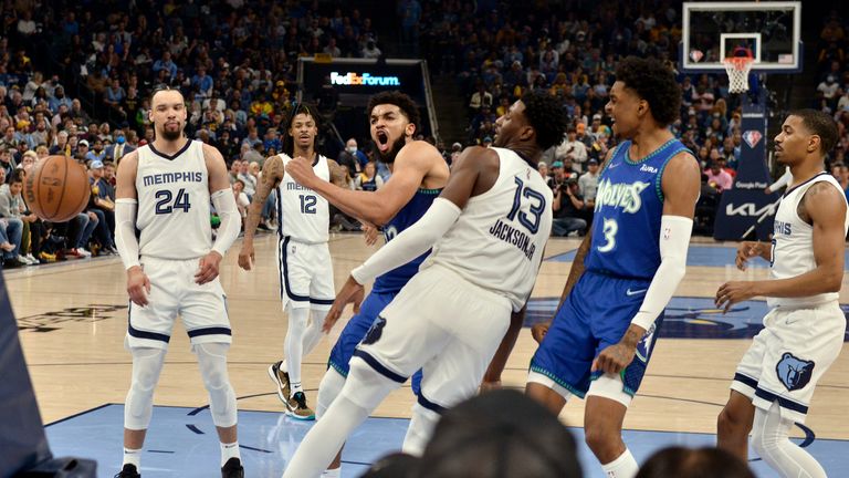 Minnesota Timberwolves quarterback Karl-Anthony Towns, center left, reacts after scoring against the Memphis Grizzlies in the second half of Game One of the first round of the NBA basketball series on Saturday, April 16, 2023, in Memphis, Tenn.