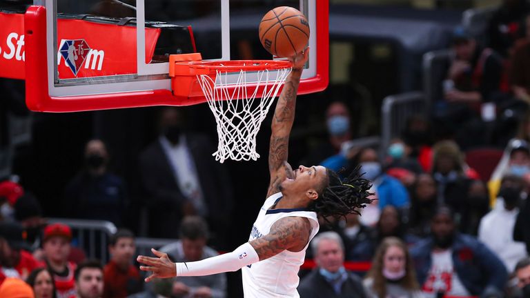 Memphis Grizzlies goalkeeper Ja Morant (12) leads to the basket to grab a corner kick during an NBA game between the Memphis Grizzlies and the Chicago Bulls on February 26, 2023 at United Center in Chicago, Illinois. 