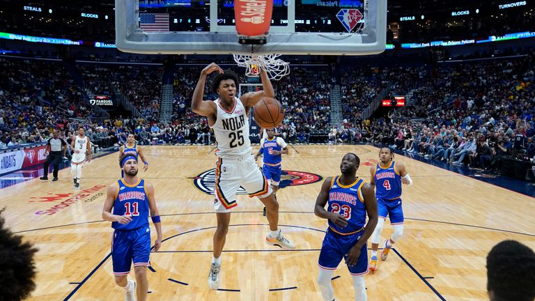 New Orleans Pelicans guard Trey Murphy III (25) criticizes the sinking of Golden State Warriors Clay Thompson (11) and forward Draymond Green (23) in the first half of an NBA basketball game in New Orleans, Sunday, April 10, 2023. 