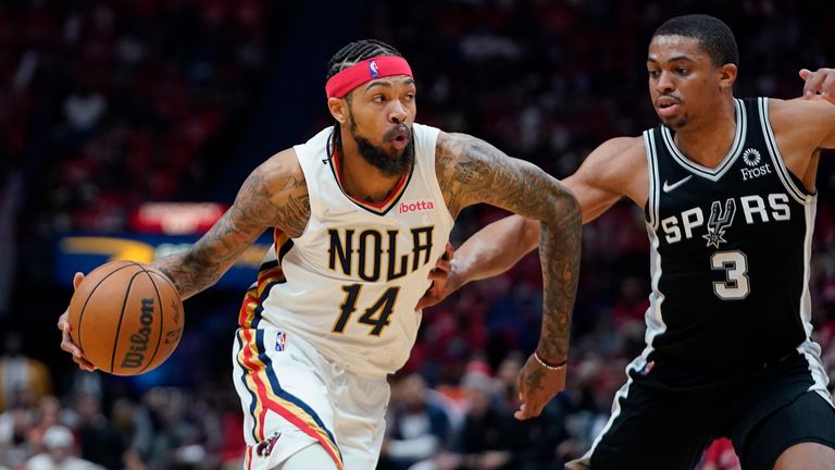 New Orleans Pelicans forward Brandon Ingram leads the basket against San Antonio Spurs forward Keldon Johnson 