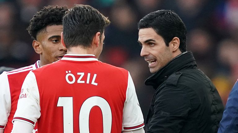 Ozil and Arsenal manager Mikel Arteta (right) clashed in a similar cloud of controversy