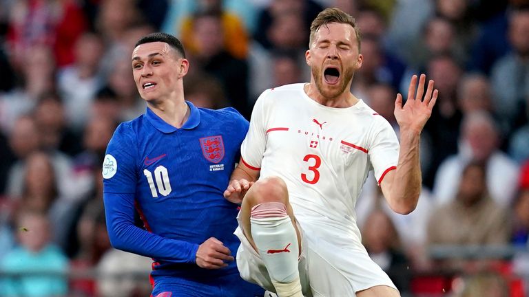 Sylvain Widmer challenges Phil Foden