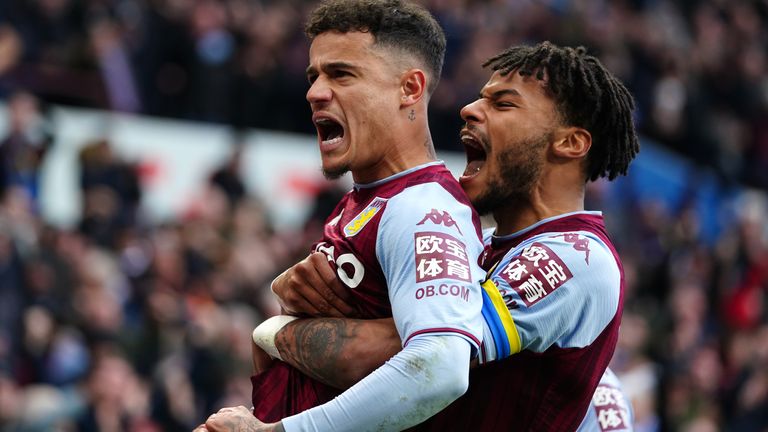 Philippe Coutinho (left) celebrated Aston Villa's third goal for Aston Villa . Tyrone Mings