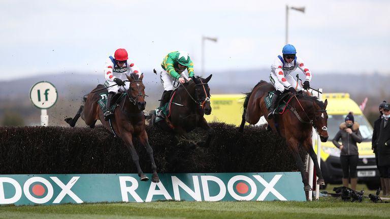 Protektorat (red cap) finally jumps into Aintree along with Phoenix Way and Hitman