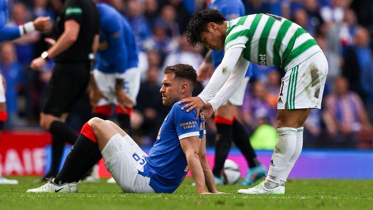 GLASCOW, SCOTLAND - APRIL 17: Rio Hattat with injured Aaron Ramsey during the Scottish Cup semi-final between Celtic and Rangers at Hampden Park, on April 17, 2023, in Glasgow, Scotland.  (Photo by Craig Williamson/SNS Group)