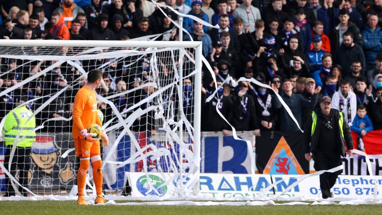A Rangers fan threw banners on the pitch in Dundee in protest against the friendly match played in Australia. 