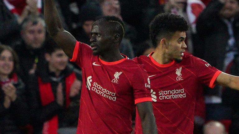 Sadio Mane (left) celebrates Liverpool's first goal in the match