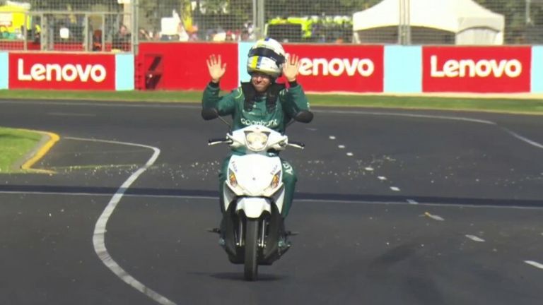 Sebastian Vettel entertains the crowd on his way back to the pits after suffering an engine failure. 