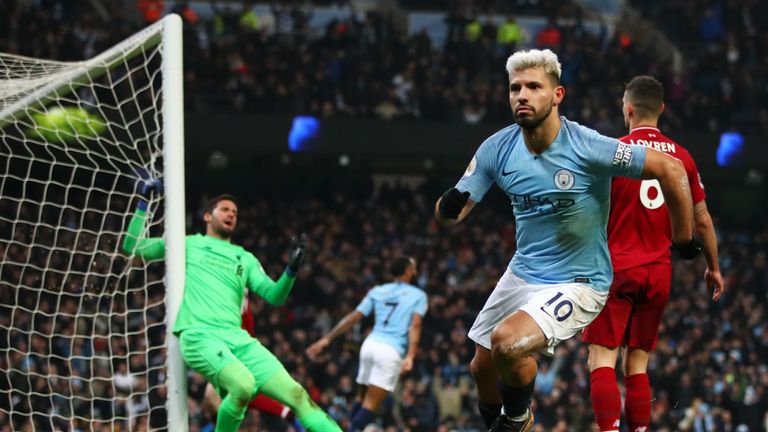 Sergio Aguero kicks off goal in celebration after giving Manchester City the lead