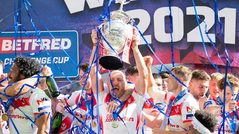 Celebration: James Robbie lifts the Challenge Cup for St Helens in 2023, in the club's first win at Wembley since 2008. 