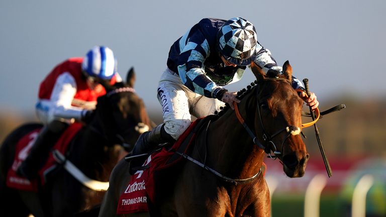 Thomas Darby moves away from Team On The Blind Side to win the Long Distance Hurdle in Newbury