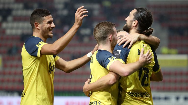 Union Saint-Gilloise players celebrate.  The club has returned to the first division of Belgium and is at the top of the standings.