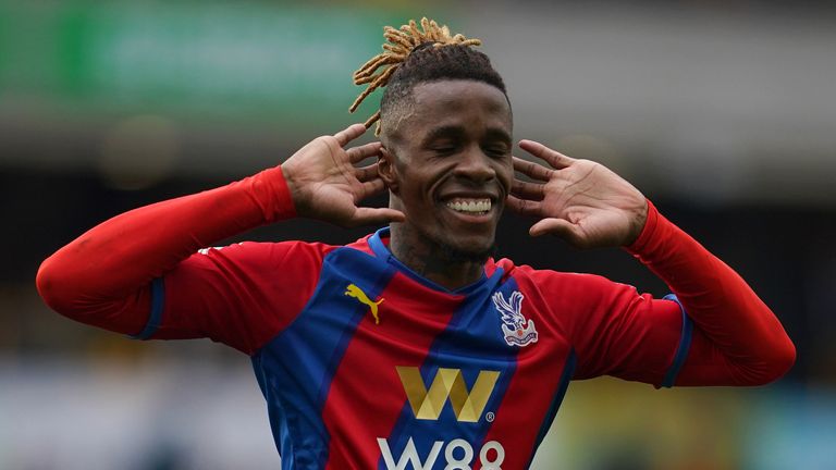 Wilfried Zaha of Crystal Palace celebrates with his eyes closed after doubling their lead