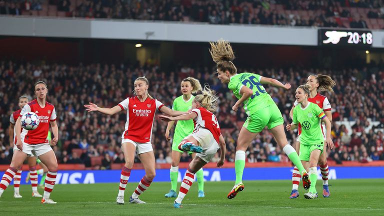 Tabia Wassmuth of VFL Wolfsburg scores his team's first goal against Arsenal